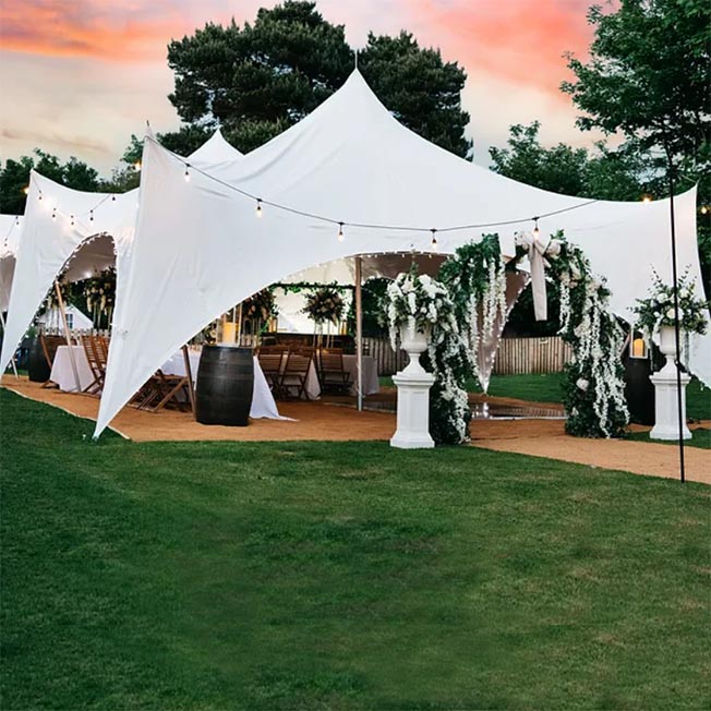 28' x 38' Capri Tent with white canopy installed on grass 